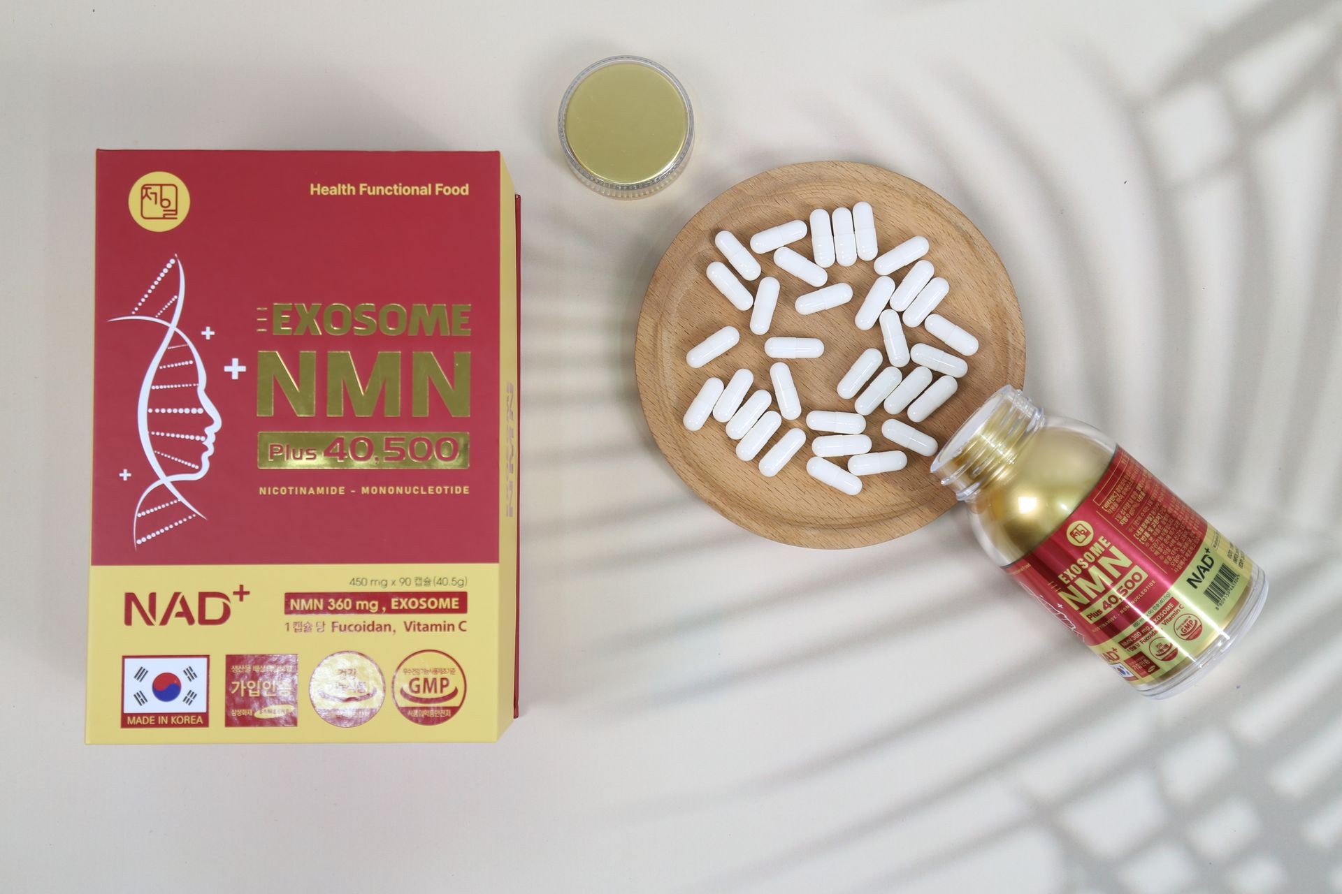 Exosome NMN supplement packaging with capsules on a wooden tray and bottle.