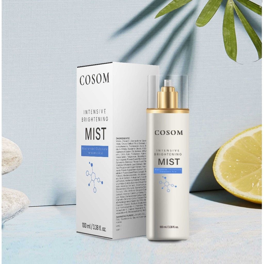 Cosom Intensive Brightening Mist bottle and box with lemon slice and palm leaf.