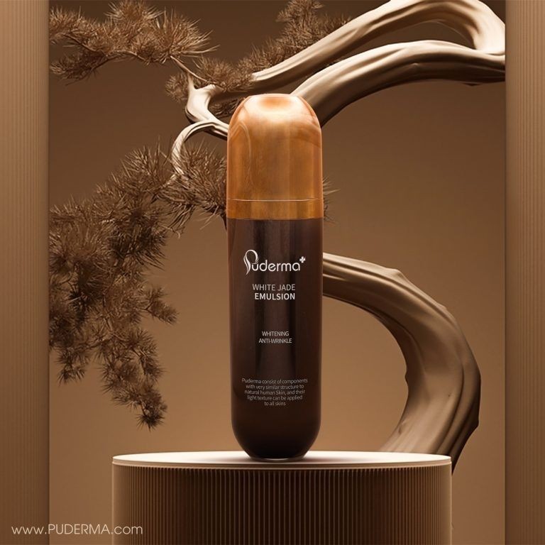 Brown bottle of Puderma White Jade Emulsion on a pedestal with abstract background.